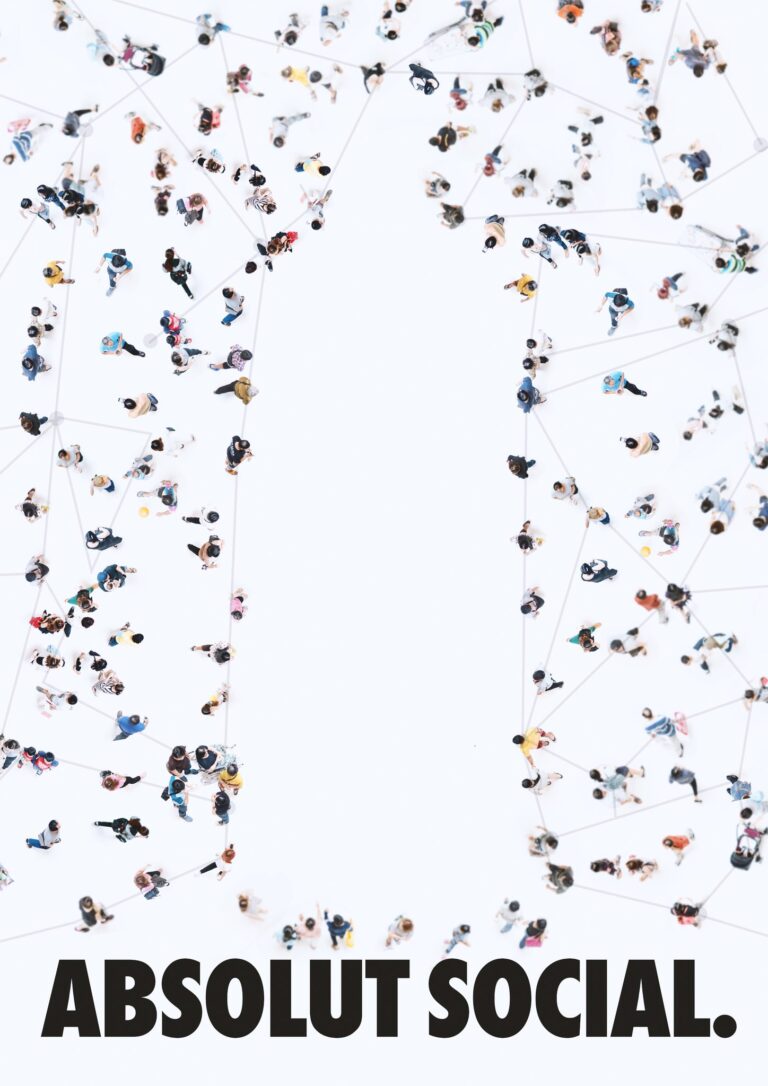 Absolut Social ad: a loose crowd on white seen from above, joined person to person by thin gray lines, leaving an open space in the shape of the Absolut bottle, and the headline ABSOLUT SOCIAL. in black.