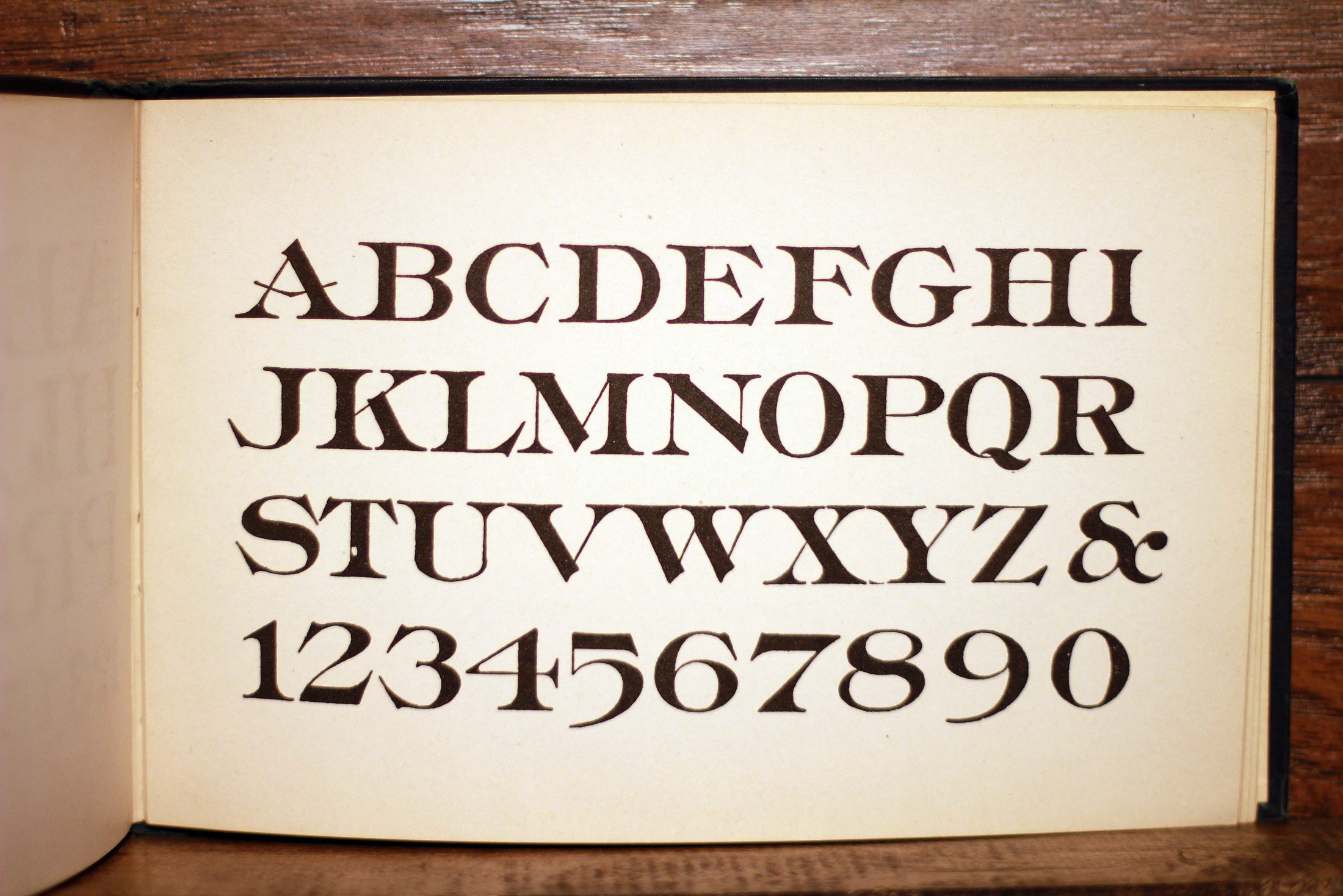 The open book at page 52, showing alphabet No. 119: capitals, ampersand and figures.