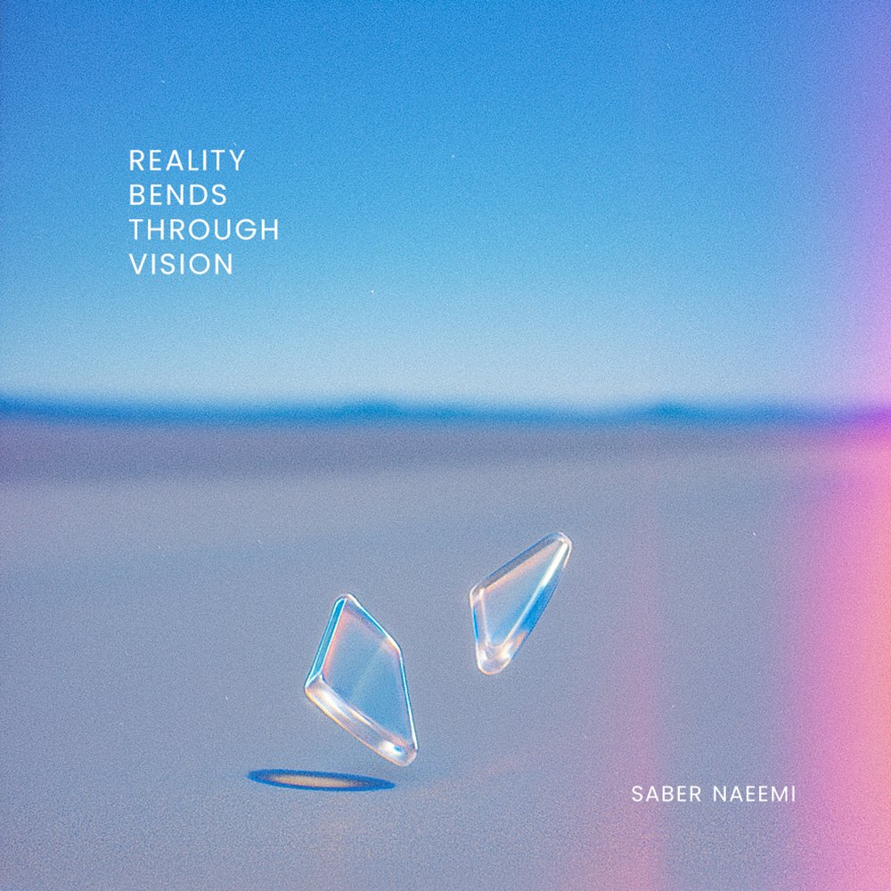 Reality Bends Through Vision single cover: two clear glass shards floating above a pale salt flat under a blue sky, with a pink light leak on the right edge.