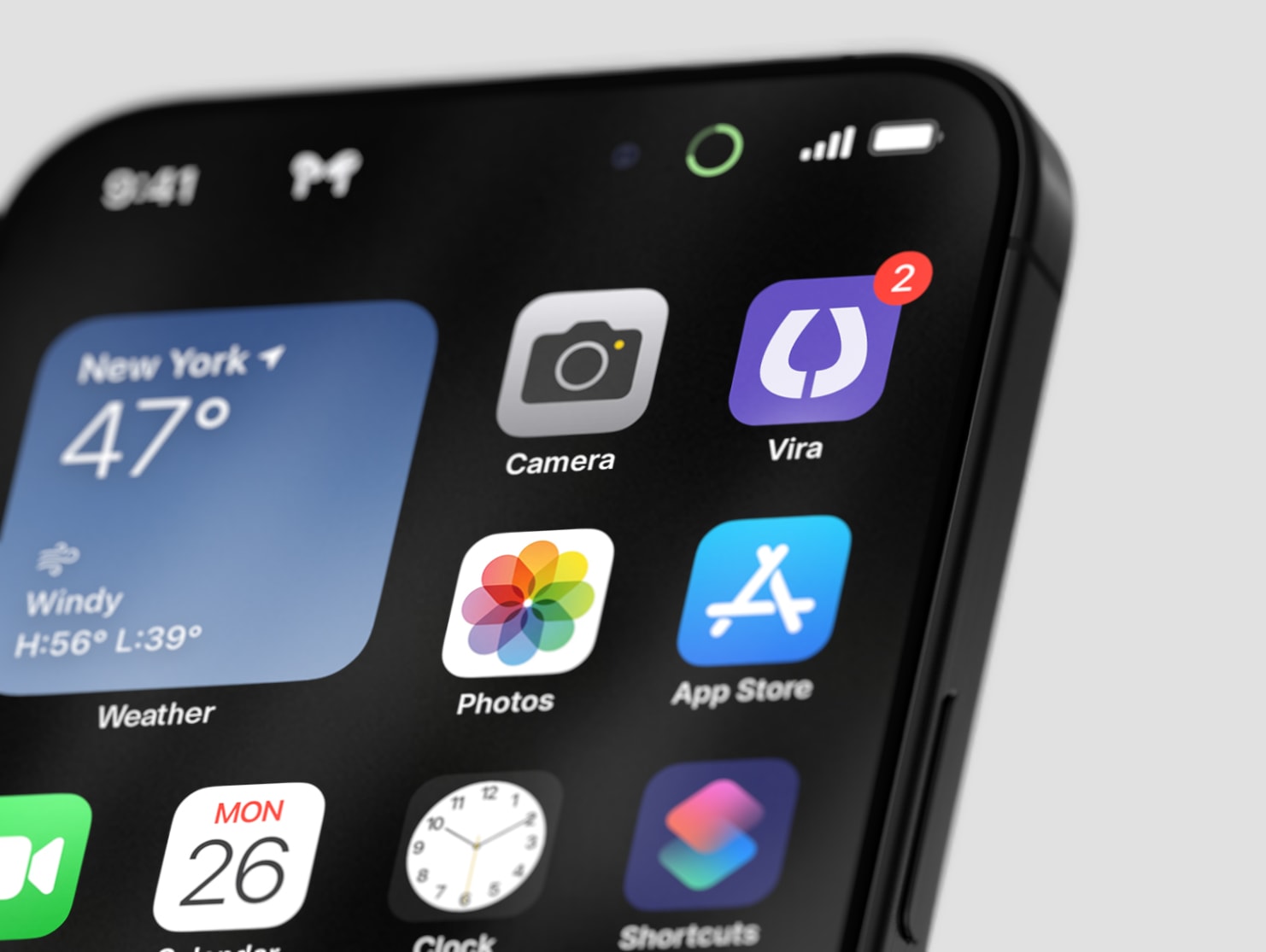 A phone home screen with the Vira app icon, the white V on purple, beside the Camera and App Store icons.